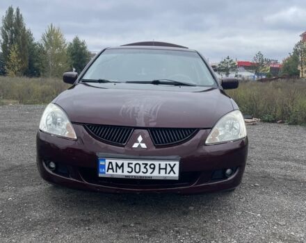 Красный Мицубиси Лансер, объемом двигателя 2 л и пробегом 295 тыс. км за 4150 $, фото 2 на Automoto.ua