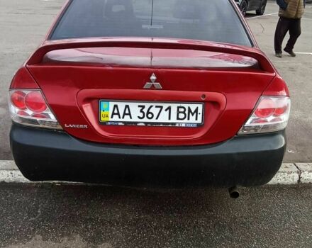 Красный Мицубиси Лансер, объемом двигателя 2 л и пробегом 320 тыс. км за 4600 $, фото 3 на Automoto.ua