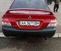 Красный Мицубиси Лансер, объемом двигателя 2 л и пробегом 320 тыс. км за 4600 $, фото 3 на Automoto.ua
