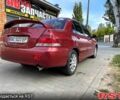 Червоний Міцубісі Lancer, об'ємом двигуна 1.6 л та пробігом 290 тис. км за 4250 $, фото 5 на Automoto.ua