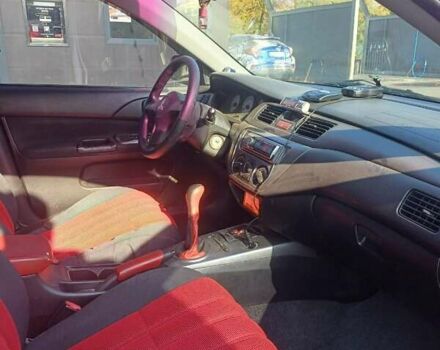 Красный Мицубиси Лансер, объемом двигателя 1.6 л и пробегом 73 тыс. км за 5500 $, фото 8 на Automoto.ua