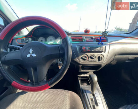 Красный Мицубиси Лансер, объемом двигателя 1.6 л и пробегом 290 тыс. км за 4350 $, фото 11 на Automoto.ua