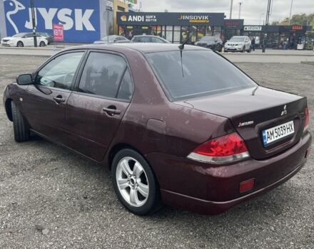 Красный Мицубиси Лансер, объемом двигателя 2 л и пробегом 295 тыс. км за 4150 $, фото 6 на Automoto.ua