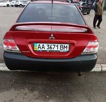 Красный Мицубиси Лансер, объемом двигателя 2 л и пробегом 320 тыс. км за 4600 $, фото 7 на Automoto.ua
