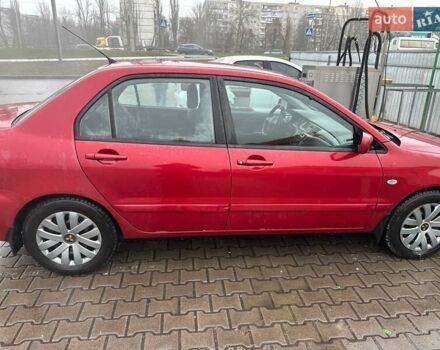 Красный Мицубиси Лансер, объемом двигателя 1.6 л и пробегом 185 тыс. км за 5000 $, фото 5 на Automoto.ua