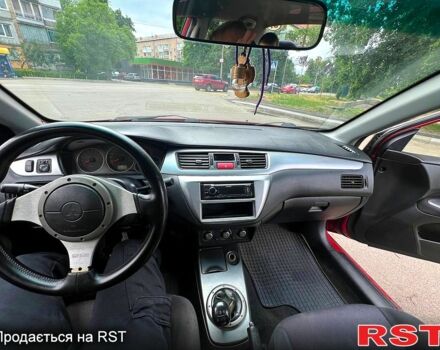 Красный Мицубиси Лансер, объемом двигателя 2 л и пробегом 223 тыс. км за 2900 $, фото 5 на Automoto.ua