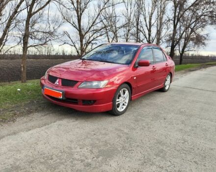Червоний Міцубісі Lancer, об'ємом двигуна 2 л та пробігом 280 тис. км за 4500 $, фото 1 на Automoto.ua