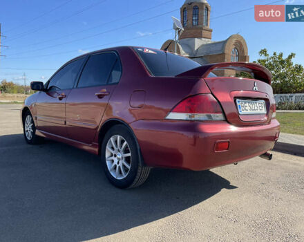 Красный Мицубиси Лансер, объемом двигателя 1.6 л и пробегом 290 тыс. км за 4350 $, фото 5 на Automoto.ua