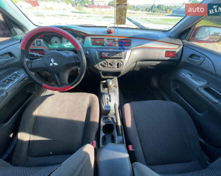 Червоний Міцубісі Lancer, об'ємом двигуна 1.58 л та пробігом 290 тис. км за 4350 $, фото 10 на Automoto.ua
