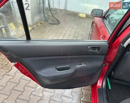 Красный Мицубиси Лансер, объемом двигателя 1.6 л и пробегом 185 тыс. км за 5000 $, фото 10 на Automoto.ua