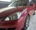 Червоний Міцубісі Lancer, об'ємом двигуна 1.6 л та пробігом 150 тис. км за 3600 $, фото 1 на Automoto.ua