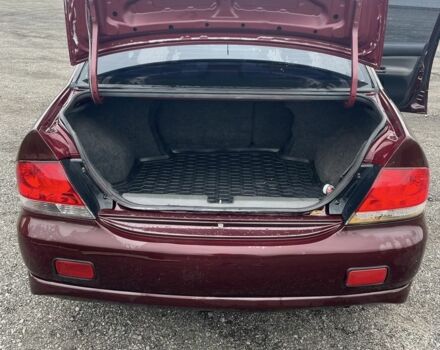 Красный Мицубиси Лансер, объемом двигателя 2 л и пробегом 295 тыс. км за 4150 $, фото 7 на Automoto.ua