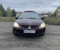 Червоний Міцубісі Lancer, об'ємом двигуна 2 л та пробігом 295 тис. км за 4150 $, фото 1 на Automoto.ua