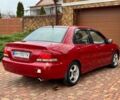 Красный Мицубиси Лансер, объемом двигателя 1.6 л и пробегом 239 тыс. км за 4100 $, фото 5 на Automoto.ua