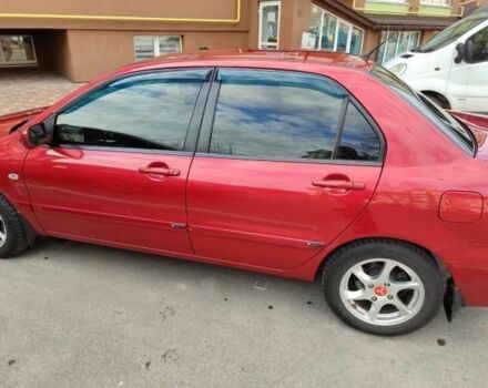 Червоний Міцубісі Lancer, об'ємом двигуна 1.6 л та пробігом 176 тис. км за 4500 $, фото 1 на Automoto.ua