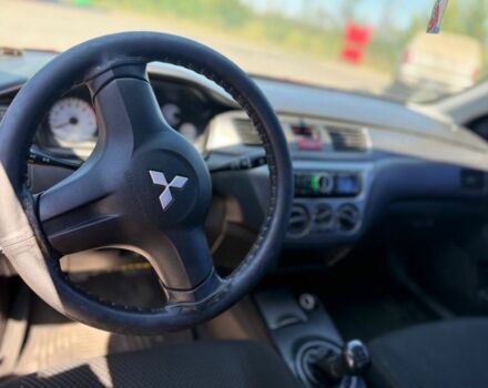 Червоний Міцубісі Lancer, об'ємом двигуна 1.6 л та пробігом 233 тис. км за 3800 $, фото 1 на Automoto.ua
