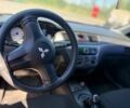 Червоний Міцубісі Lancer, об'ємом двигуна 1.6 л та пробігом 233 тис. км за 3800 $, фото 1 на Automoto.ua