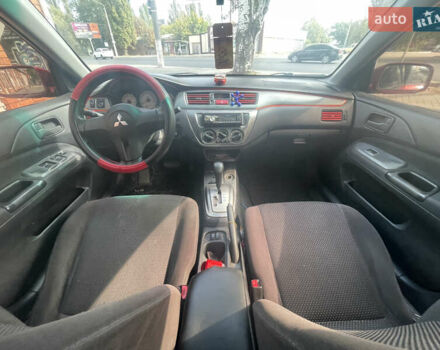 Червоний Міцубісі Lancer, об'ємом двигуна 1.58 л та пробігом 290 тис. км за 4250 $, фото 15 на Automoto.ua