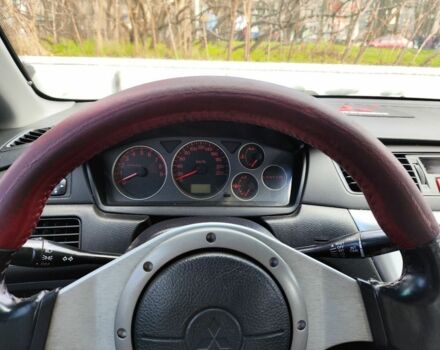 Червоний Міцубісі Lancer, об'ємом двигуна 2 л та пробігом 280 тис. км за 4500 $, фото 4 на Automoto.ua