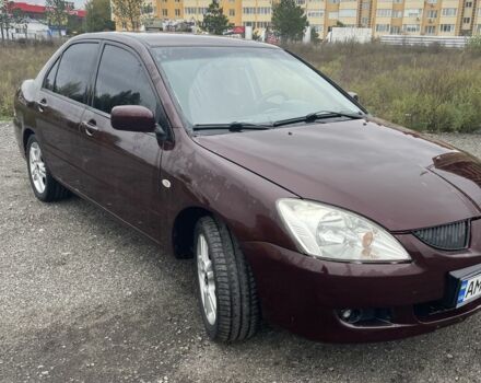 Красный Мицубиси Лансер, объемом двигателя 2 л и пробегом 295 тыс. км за 4150 $, фото 3 на Automoto.ua