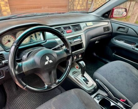 Красный Мицубиси Лансер, объемом двигателя 1.6 л и пробегом 239 тыс. км за 4100 $, фото 6 на Automoto.ua