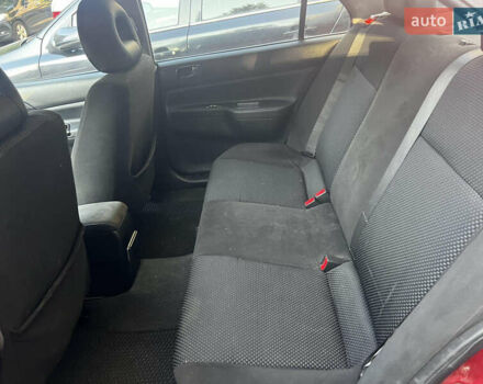 Красный Мицубиси Лансер, объемом двигателя 1.6 л и пробегом 312 тыс. км за 4600 $, фото 5 на Automoto.ua