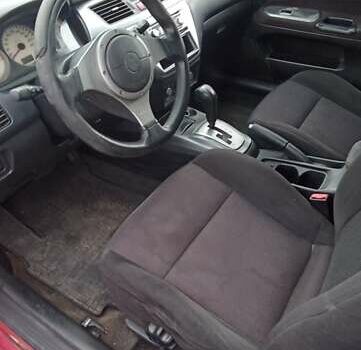 Красный Мицубиси Лансер, объемом двигателя 2 л и пробегом 320 тыс. км за 4600 $, фото 6 на Automoto.ua