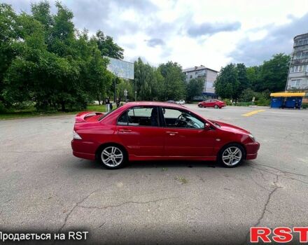 Красный Мицубиси Лансер, объемом двигателя 2 л и пробегом 223 тыс. км за 2900 $, фото 12 на Automoto.ua