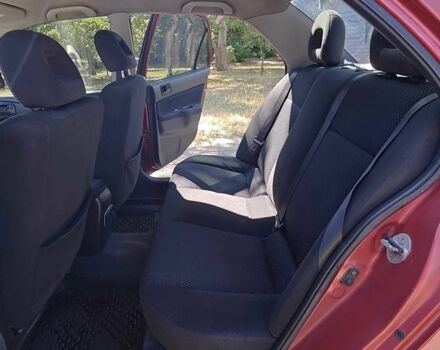 Красный Мицубиси Лансер, объемом двигателя 1.6 л и пробегом 216 тыс. км за 4500 $, фото 7 на Automoto.ua