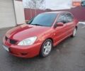 Червоний Міцубісі Lancer, об'ємом двигуна 1.6 л та пробігом 330 тис. км за 4350 $, фото 1 на Automoto.ua