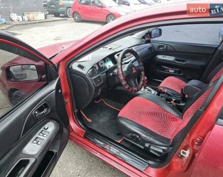 Червоний Міцубісі Lancer, об'ємом двигуна 1.6 л та пробігом 267 тис. км за 2999 $, фото 10 на Automoto.ua