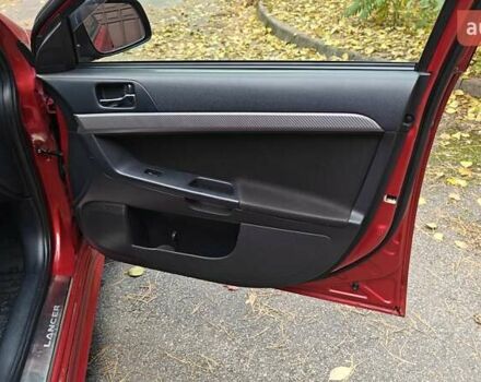 Красный Мицубиси Лансер, объемом двигателя 2 л и пробегом 186 тыс. км за 5600 $, фото 26 на Automoto.ua