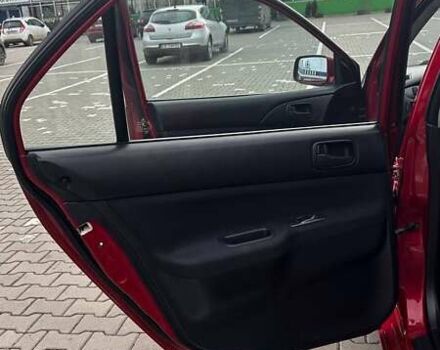 Красный Мицубиси Лансер, объемом двигателя 1.6 л и пробегом 176 тыс. км за 4300 $, фото 22 на Automoto.ua