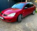 Червоний Міцубісі Lancer, об'ємом двигуна 1.6 л та пробігом 185 тис. км за 3900 $, фото 4 на Automoto.ua
