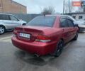 Красный Мицубиси Лансер, объемом двигателя 1.58 л и пробегом 269 тыс. км за 3899 $, фото 4 на Automoto.ua