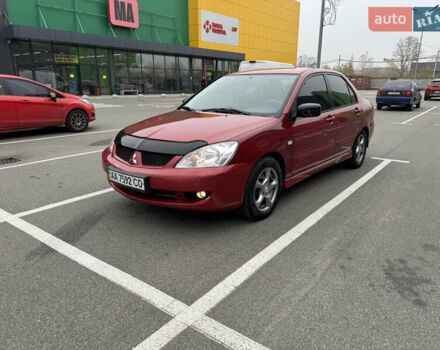Красный Мицубиси Лансер, объемом двигателя 1.58 л и пробегом 285 тыс. км за 3650 $, фото 1 на Automoto.ua