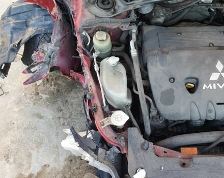 Красный Мицубиси Лансер, объемом двигателя 2 л и пробегом 406 тыс. км за 2750 $, фото 12 на Automoto.ua