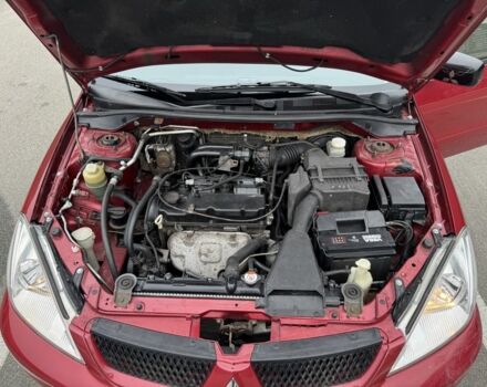 Красный Мицубиси Лансер, объемом двигателя 1.6 л и пробегом 285 тыс. км за 3650 $, фото 15 на Automoto.ua