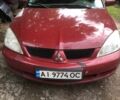 Красный Мицубиси Лансер, объемом двигателя 1.6 л и пробегом 266 тыс. км за 3499 $, фото 1 на Automoto.ua