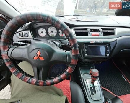 Червоний Міцубісі Lancer, об'ємом двигуна 1.6 л та пробігом 267 тис. км за 2999 $, фото 14 на Automoto.ua