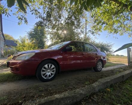 Красный Мицубиси Лансер, объемом двигателя 1.6 л и пробегом 277 тыс. км за 3299 $, фото 2 на Automoto.ua