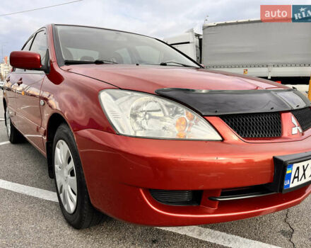 Червоний Міцубісі Lancer, об'ємом двигуна 1.6 л та пробігом 194 тис. км за 5500 $, фото 14 на Automoto.ua