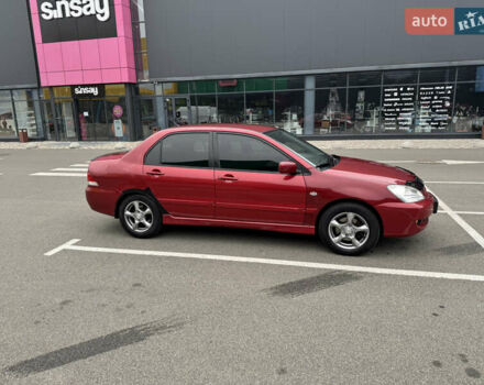 Красный Мицубиси Лансер, объемом двигателя 1.58 л и пробегом 285 тыс. км за 3650 $, фото 5 на Automoto.ua