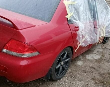 Красный Мицубиси Лансер, объемом двигателя 1.6 л и пробегом 155 тыс. км за 2000 $, фото 4 на Automoto.ua