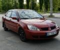Красный Мицубиси Лансер, объемом двигателя 1.6 л и пробегом 260 тыс. км за 3350 $, фото 1 на Automoto.ua