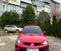 Червоний Міцубісі Lancer, об'ємом двигуна 2 л та пробігом 218 тис. км за 5100 $, фото 1 на Automoto.ua