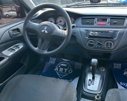 Красный Мицубиси Лансер, объемом двигателя 1.6 л и пробегом 230 тыс. км за 5300 $, фото 6 на Automoto.ua