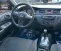 Красный Мицубиси Лансер, объемом двигателя 1.6 л и пробегом 230 тыс. км за 5300 $, фото 6 на Automoto.ua