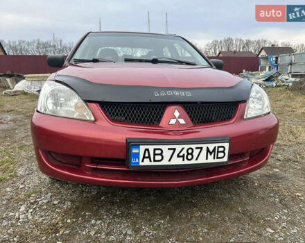 Красный Мицубиси Лансер, объемом двигателя 1.58 л и пробегом 280 тыс. км за 3250 $, фото 4 на Automoto.ua