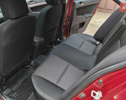 Міцубісі Lancer 2007 у Києві на Automoto.ua Червоний Міцубісі Lancer, об'ємом двигуна 2 л та пробігом 186 тис. км за 5600 $, фото 26 на Automoto.ua